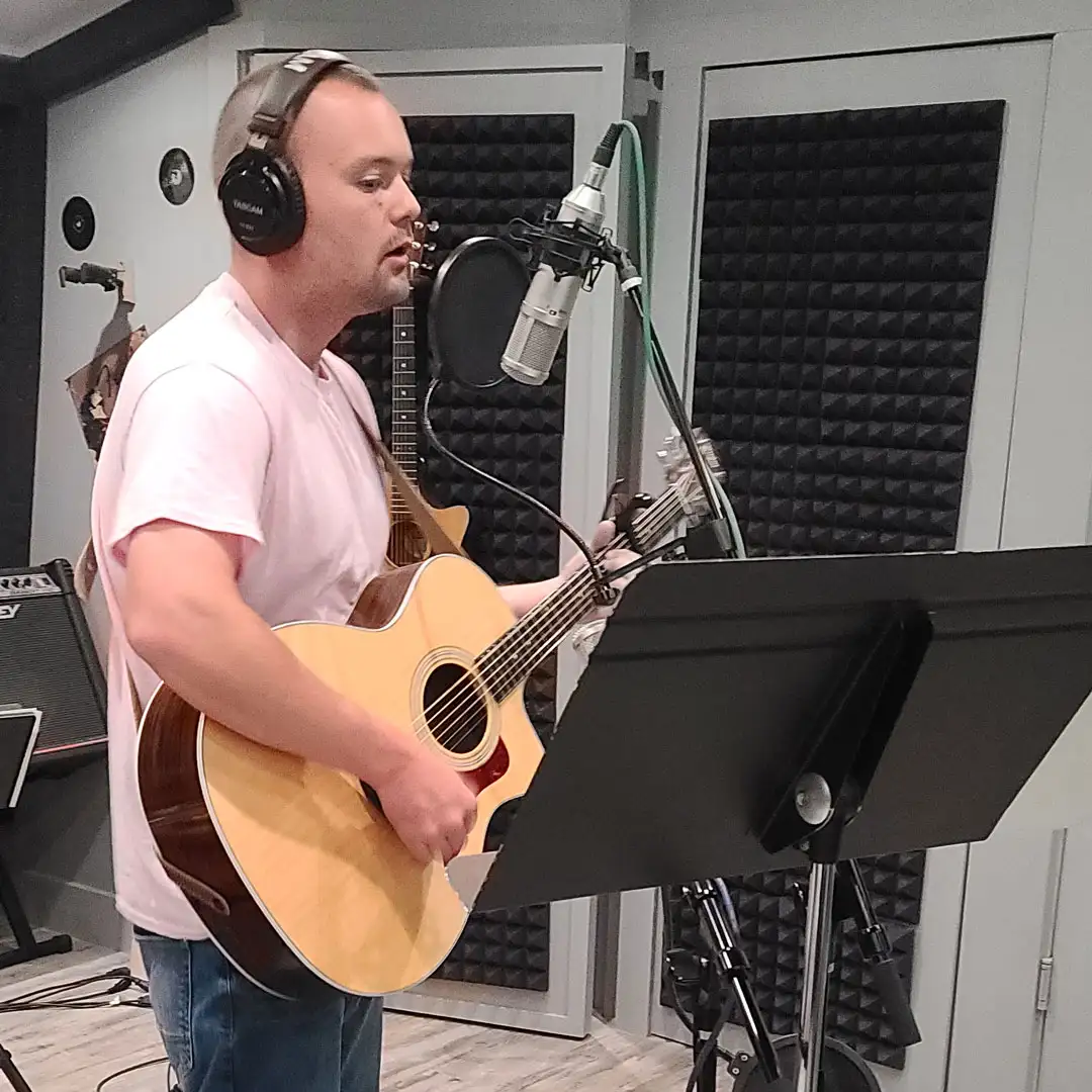 Pastor Jon recording acoustic songs