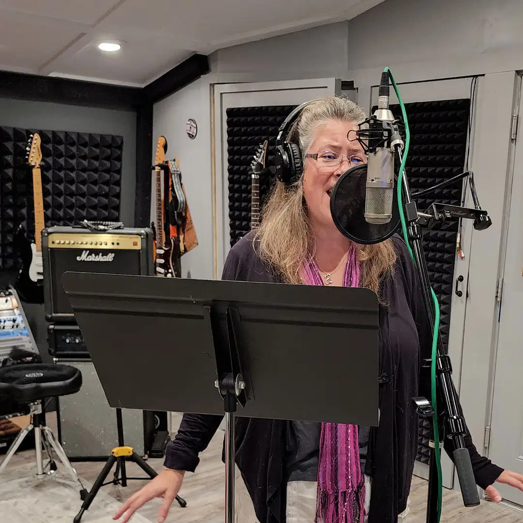 Singer, songwriter, Jennifer laying down vocals.